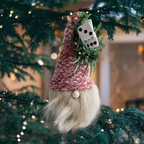 Bunco Dice Gnome ornament with red hat hanging on a decorated Christmas tree