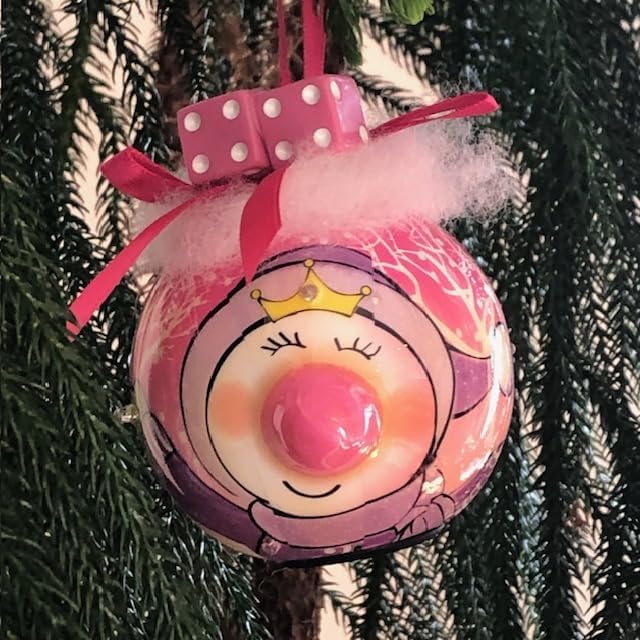 Bunco pink dice princess Christmas ornament hanging on a Christmas tree